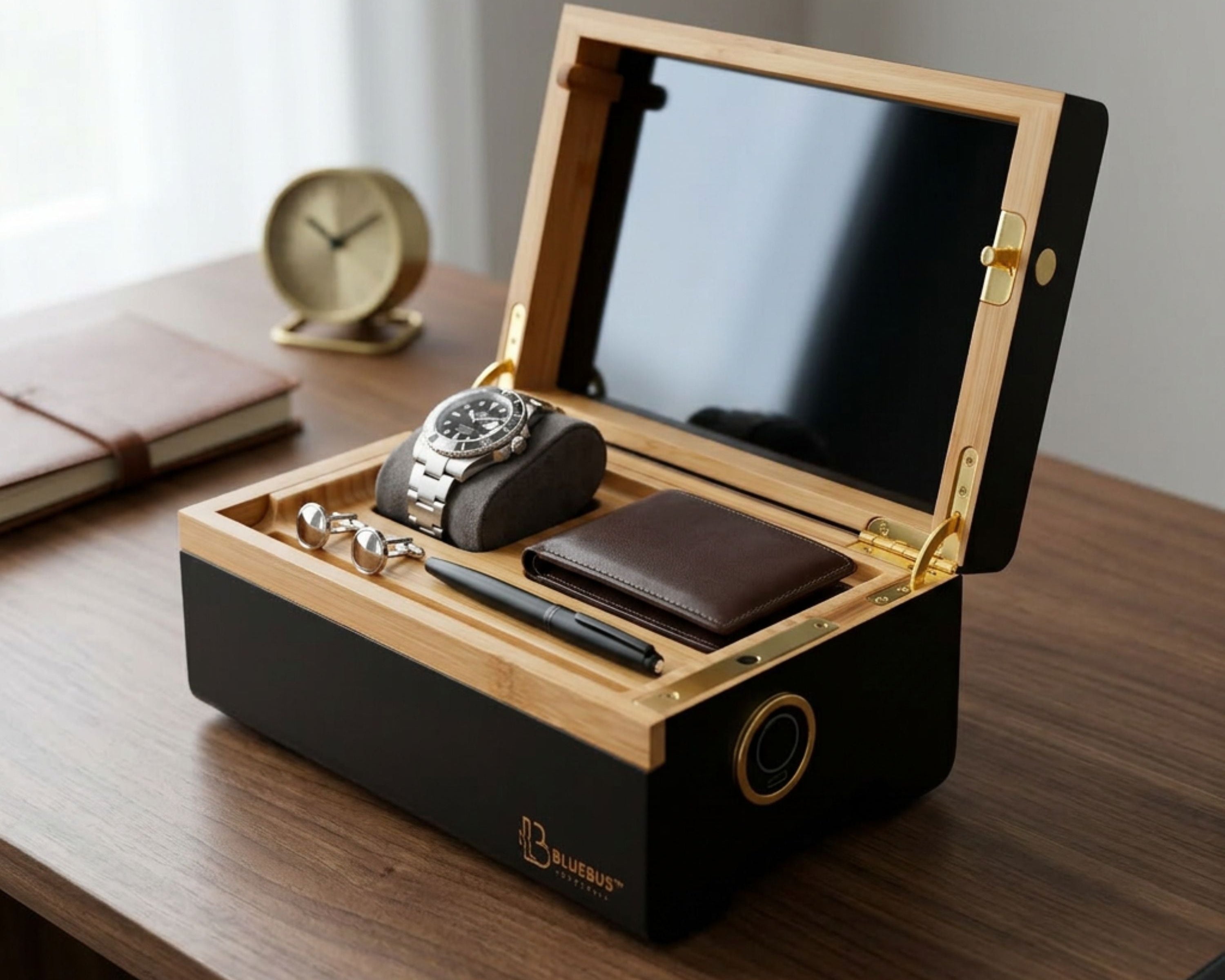 MULTIBOX open on a wooden desk with a watch inside, beside a clock and books