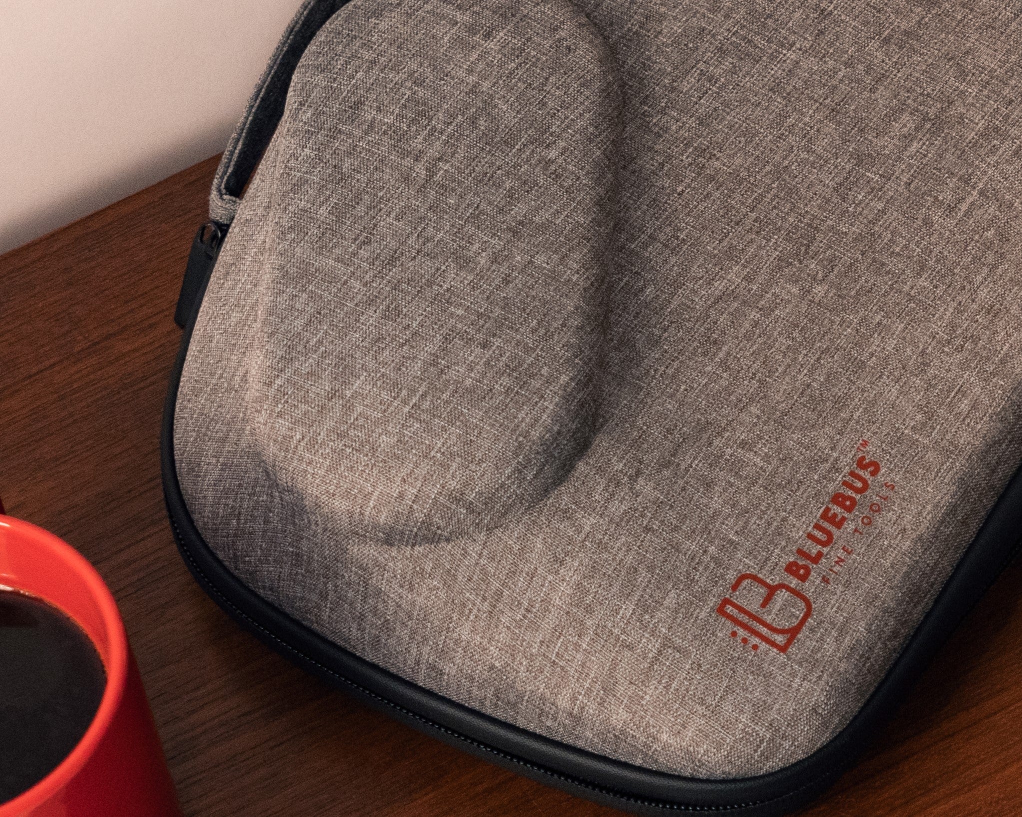 Recycled polyester (rPET) fabric — the woven shell of the BLAZE carrying bag, with the red BlueBus Fine Tools logo.